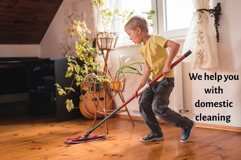 boy mopping wooden floor captioned we help you with domestic cleaning