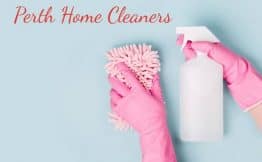 pink gloves holding a cleaning bottle and pink cloth