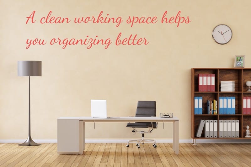minimalist home office with a modern desk, chair and laptop on a pine wood floor. Text says a clean working space helps you organizing better