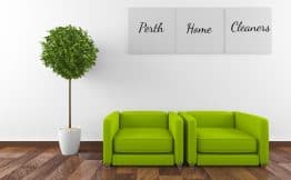 lime green sofas on a polished hardwood floor with a potted tree